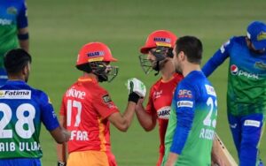 Lewis Gregory and Zafar Gohar celebrate. (Photo by Asif HASSAN / AFP) (Photo by ASIF HASSAN/AFP via Getty Images)