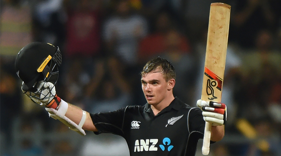 New Zealand batsman Tom Latham acknowledges the crowd after reaching his century (Photo: AFP)