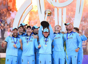 Eoin Morgan of England celebrates with his team as he lifts the Cricket World Cup trophy after the Final of the ICC Cricket World Cup 2019 between New Zealand and England at Lord's Cricket Ground on July 14, 2019 in London, England. (Photo by Clive Mason/Getty Images)