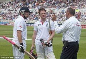 An increasingly irate Ian Bell (left) and Eoin Morgan are prevented from leaving the field before tea
