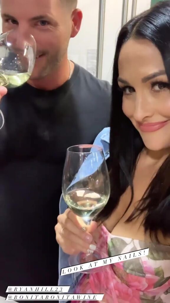 WWE Star Nikki Bella Celebrates Wine Bottling Day In Gorgeous Floral Dress 3