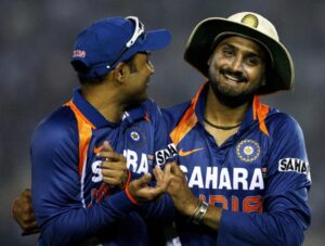 IMAGE: Virender Sehwag (left) and Harbhajan Singh share a laugh during an ODI against Australia in Mohali in November 2009. Photograph: Mark Kolbe/Getty Images