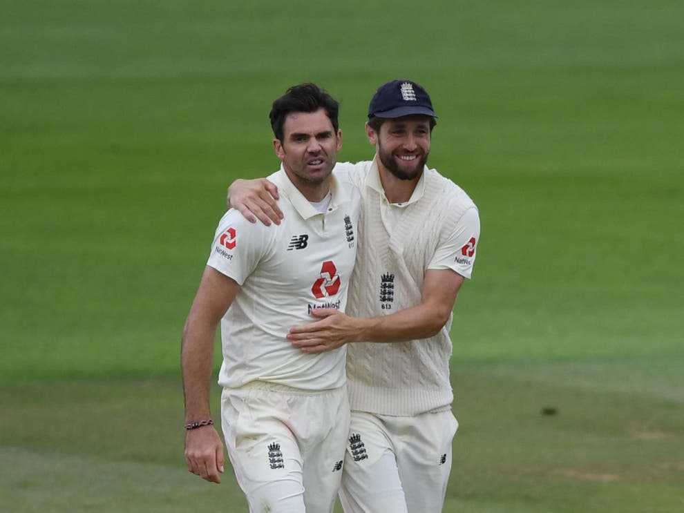 A snarling James Anderson is congratulated on his five-fer by Chris Woakes (Getty)
