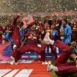 West Indies players celebrate with the T20 WC Trophy [Image-Getty]