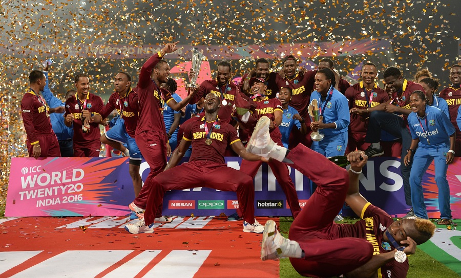 West Indies players celebrate with the T20 WC Trophy [Image-Getty]