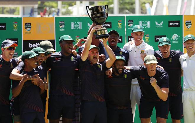 South Africa's Dean Elgar celebrates with teammates and the trophy after winning the match and the series, Third Test - South Africa v India - Newlands Cricket Ground, Cape Town, South Africa - January 14, 2022 | Photo Credit: Reuters