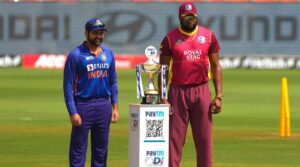 India's captain Rohit Sharma, left, and West Indies captain Kieron Pollard pose with the winners trophy ahead of their first one day international cricket match in Ahmedabad, India, Sunday, Feb. 6, 2022. (AP Photo/Ajit Solanki)