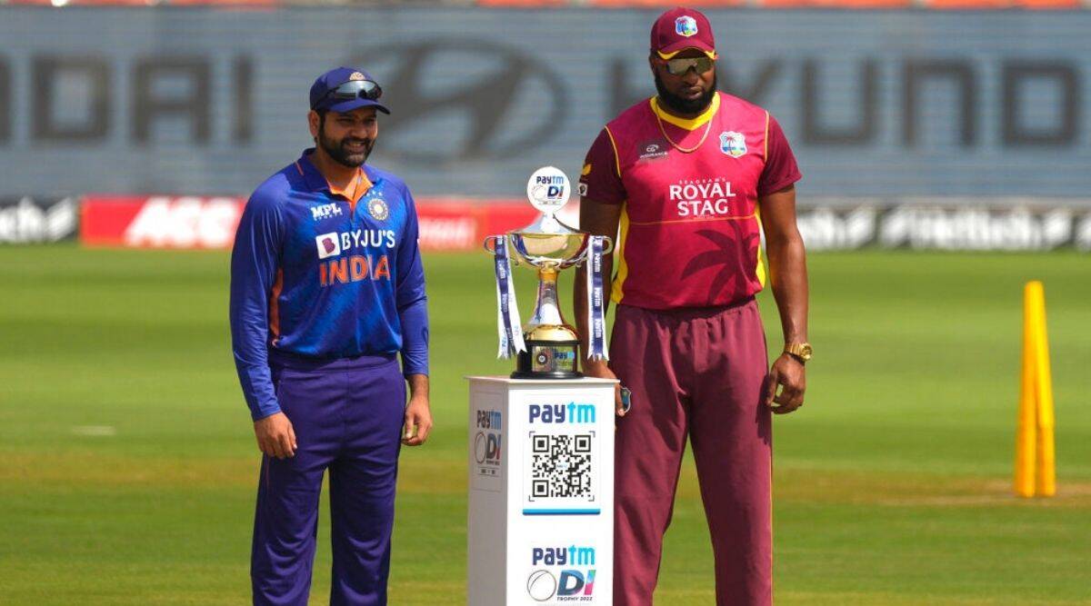 India's captain Rohit Sharma, left, and West Indies captain Kieron Pollard pose with the ODI winners trophy (AP Photo/Ajit Solanki)