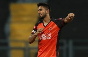 Sunrisers Hyderabad pacer Umran Malik celebrates the wicket of Tilak Varma. Photograph: BCCI