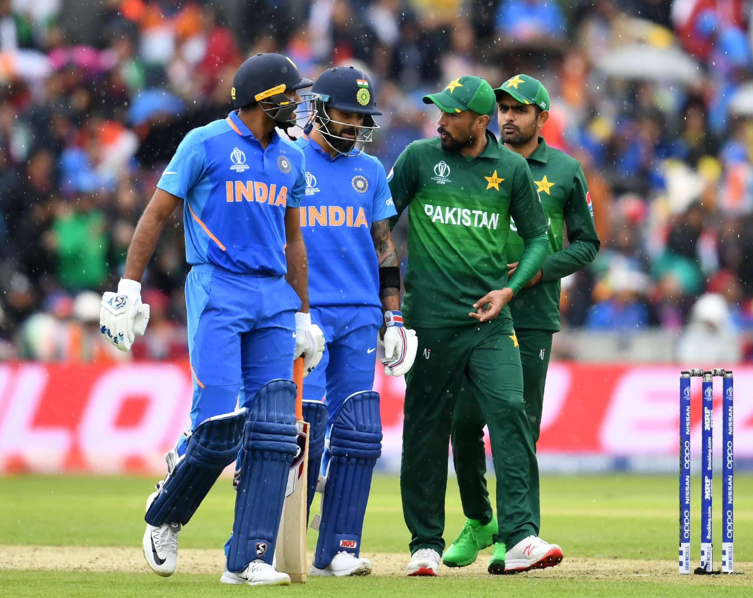 Virat Kohli with Mohammad Amir and Babar Azam