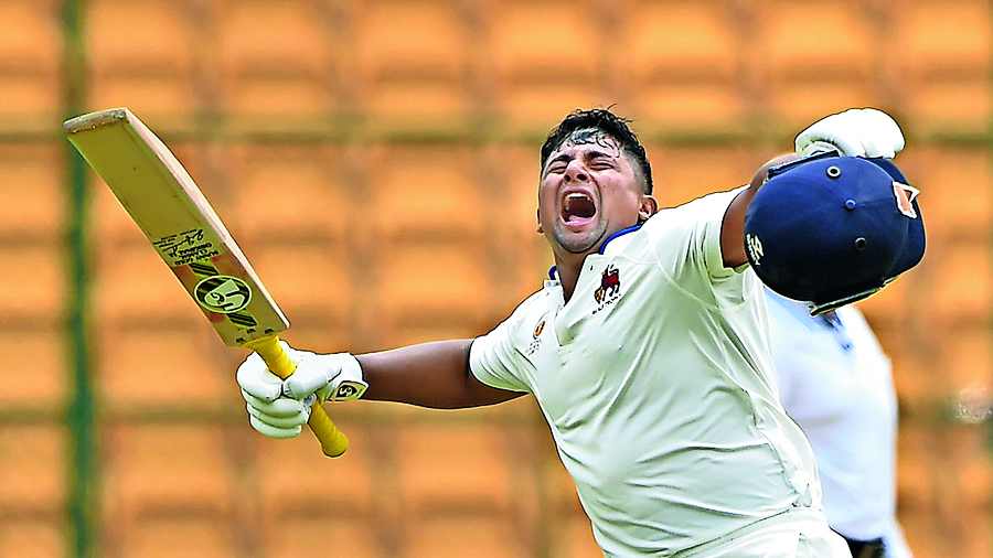 Mumbai’s Sarfaraz Khan celebrates his century on the second day of the Ranji Trophy final against Madhya Pradesh in Bangalore on Thursday. PTI