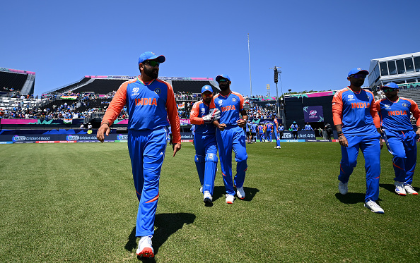 NEW YORK, NEW YORK - JUNE 01: Rohit Sharma of India leads his side out during the ICC Men's T20 Cricket World Cup West Indies & USA 2024 warm-up match between Bangladesh and India at Nassau County International Cricket Stadium on June 01, 2024 in New York, New York. (Photo by Alex Davidson-ICC/ICC via Getty Images)