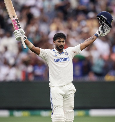 India's Nitish Kumar Reddy celebrates after passing 100 on day three of the fourth cricket Test match between Australia and India at the Melbourne Cricket Ground (MCG) in Melbourne on December 28, 2024. (Photo by Martin KEEP / AFP) / -- IMAGE RESTRICTED TO EDITORIAL USE - STRICTLY NO COMMERCIAL USE -- (Photo by MARTIN KEEP/AFP via Getty Images)